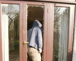 image of person breaking into home